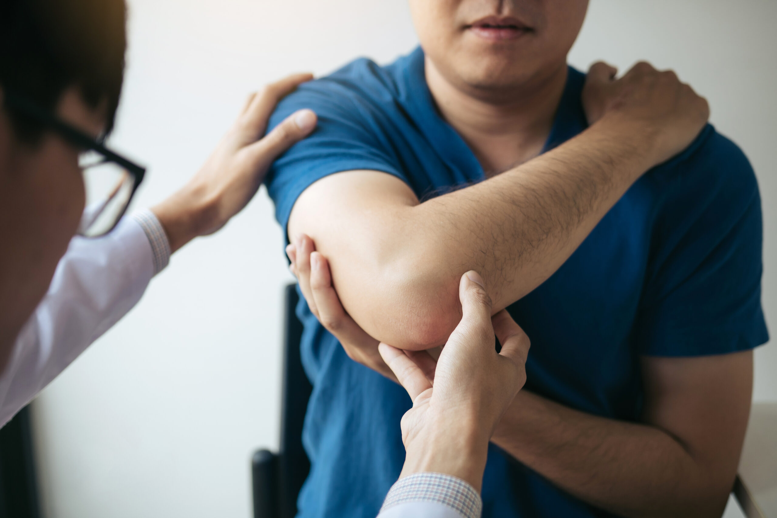 Physical therapists are checking patients elbows at the clinic o